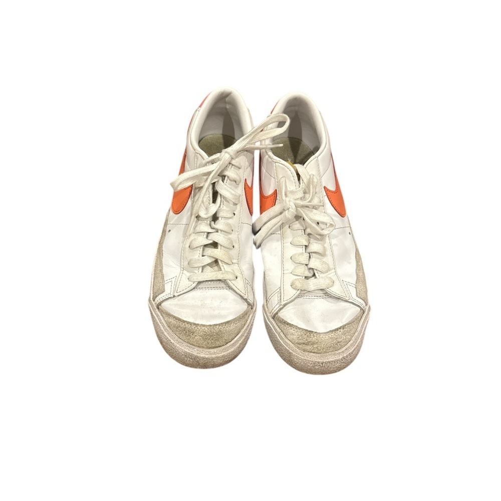 Nike Women's White Sneakers with Orange Swoosh